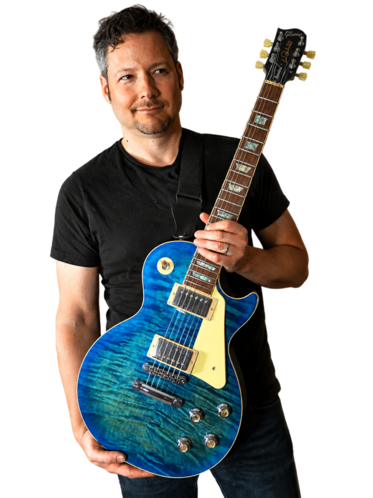 The Art of Solo Guitar Composition Book 1 Udi Glaser, guitar composer and teacher, with his guitar Bluey